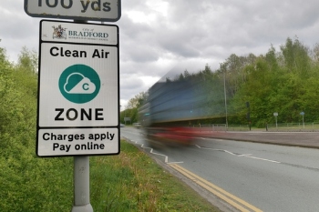 Clean Air Zone sign with truck whizzing past